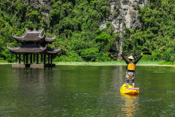Kayaking vs. Traditional Boats in Trang An Ninh Binh