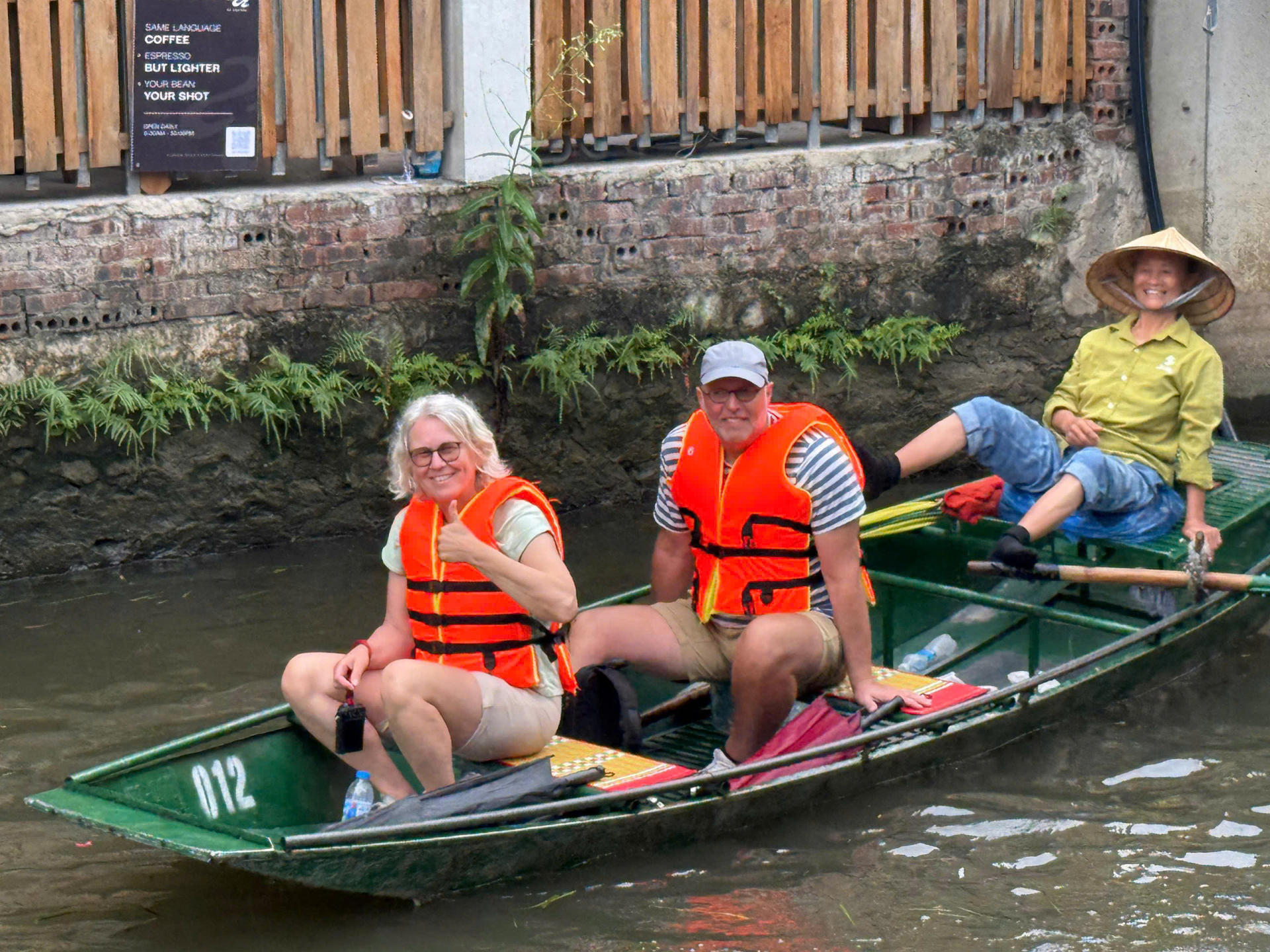 The boat rider uses their feet to control the Boat - Tam Coc boat experience