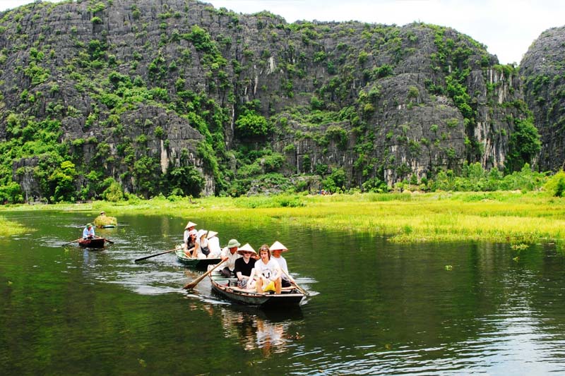 Don’t miss the breathtaking views of the harvest season during your Tam Coc Boat Tour.